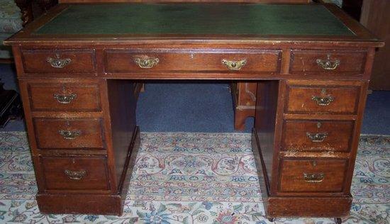 Appraisal: A late th Century walnut pedestal desk fitted a surround