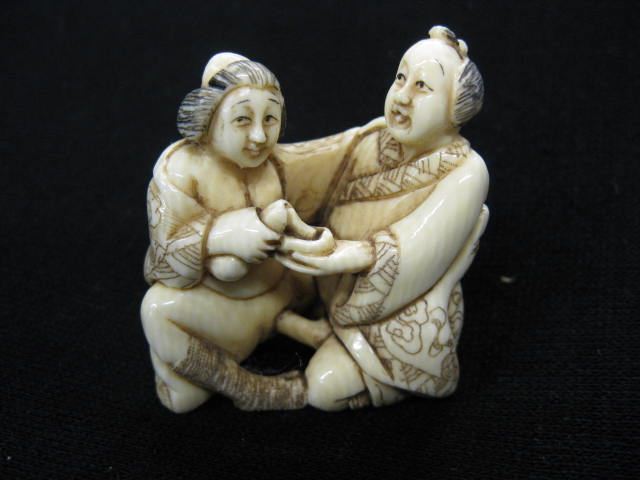 Appraisal: Carved Ivory Erotic Netsuke seated couple fancy polychrome work excellent