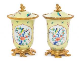 Appraisal: A Pair of French Gilt Bronze Mounted Porcelain Covered Jars