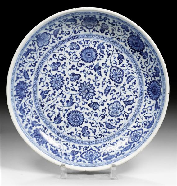 Appraisal: A LARGE BLUE AND WHITE CHARGER WITH FLOWER SCROLL DESIGN