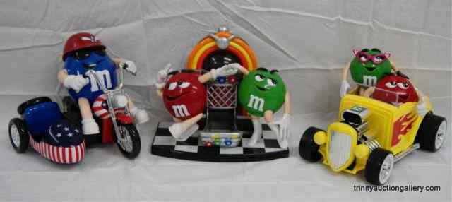 Appraisal: - M M's Character Large Candy DispensersFrom the estate is