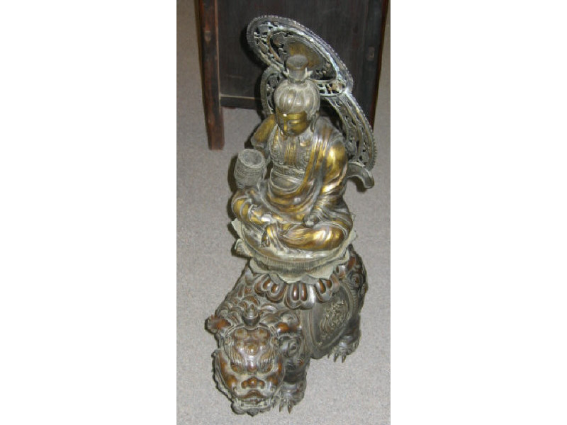 Appraisal: ASIAN BRONZE FIGURE GROUP Allover finely detailed showing a seated