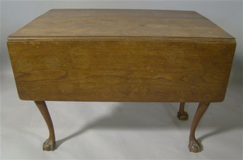 Appraisal: CHIPPENDALE MAHOGANY DROP LEAF TABLE The rectangular top flanked by