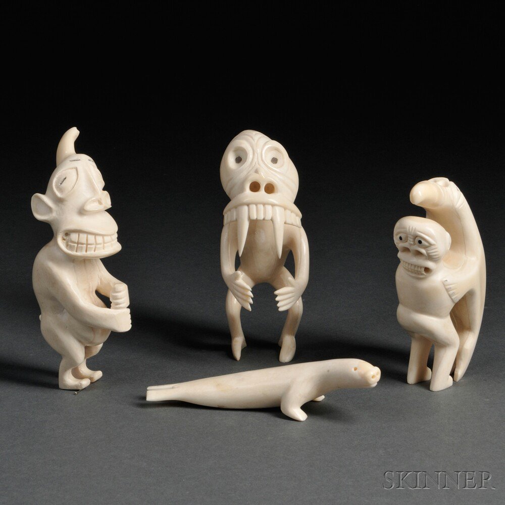 Appraisal: Four Eskimo Carved Ivory Figures three tupaliks and a seal