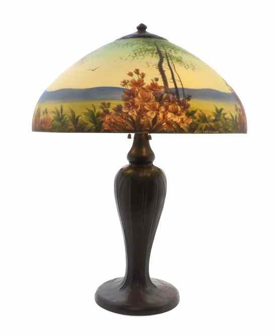 Appraisal: A Handel Reverse Painted Landscape Lamp the domed shade decorated