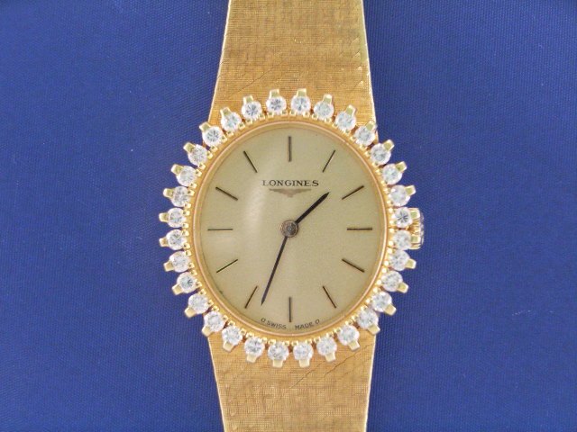 Appraisal: A Longines lady's ct gold diamond set bezel wristwatch estimated