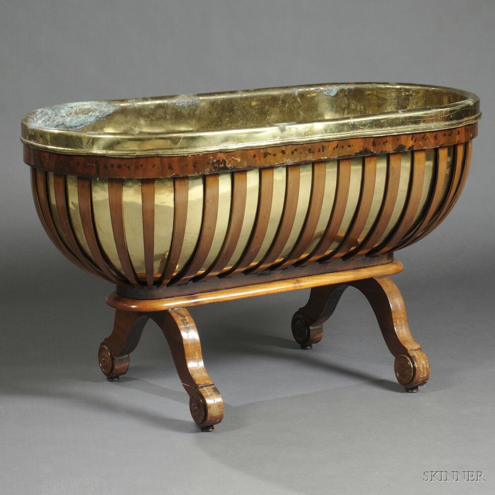 Appraisal: French Empire-style Mahogany Jardini re ovoid with curving slatted ribs