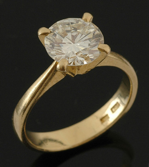 Appraisal: A solitare diamond ring The round brilliant cut diamond weighing