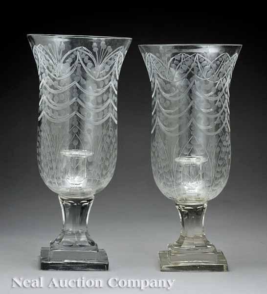 Appraisal: A Pair of Vintage Glass Photophores on square stepped plinth