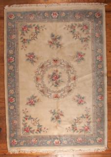 Appraisal: Indo-Chinese rug with floral motif in pastel shades of blue