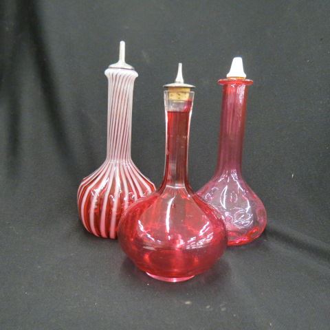 Appraisal: Cranberry Art Glass Barber Bottles including opalescent coin spot to