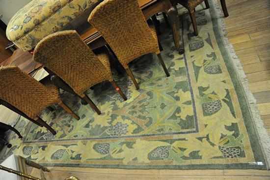 Appraisal: A LARGE 'HALI' FLOOR RUG IN GREEN YELLOW AND PURPLE