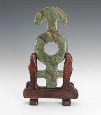 Appraisal: A Jade Bi Disc with Wooden Stand Carved of green