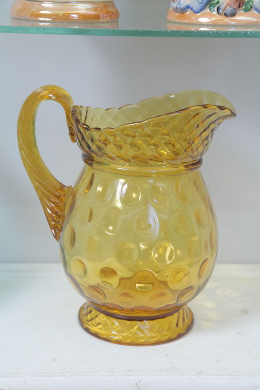 Appraisal: VICTORIAN GLASS PITCHER Amber coin spot pitcher with reeded handle