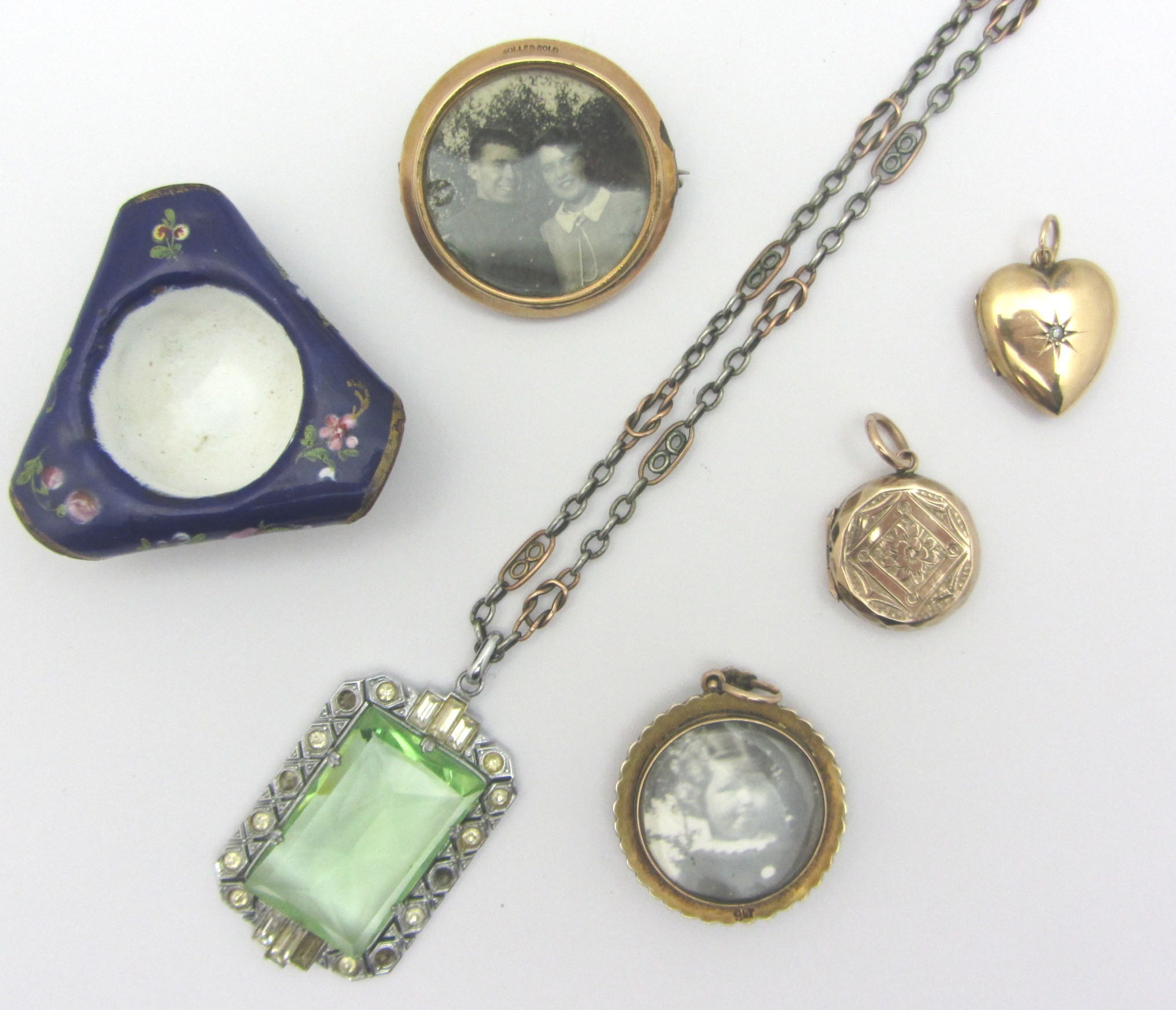 Appraisal: A gold and seed pearl set circular pendant locket glazed