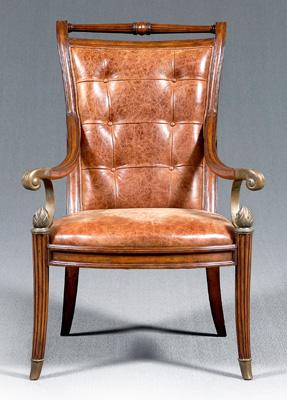 Appraisal: Maitland-Smith mahogany armchair brass handle grips and flame finials brown