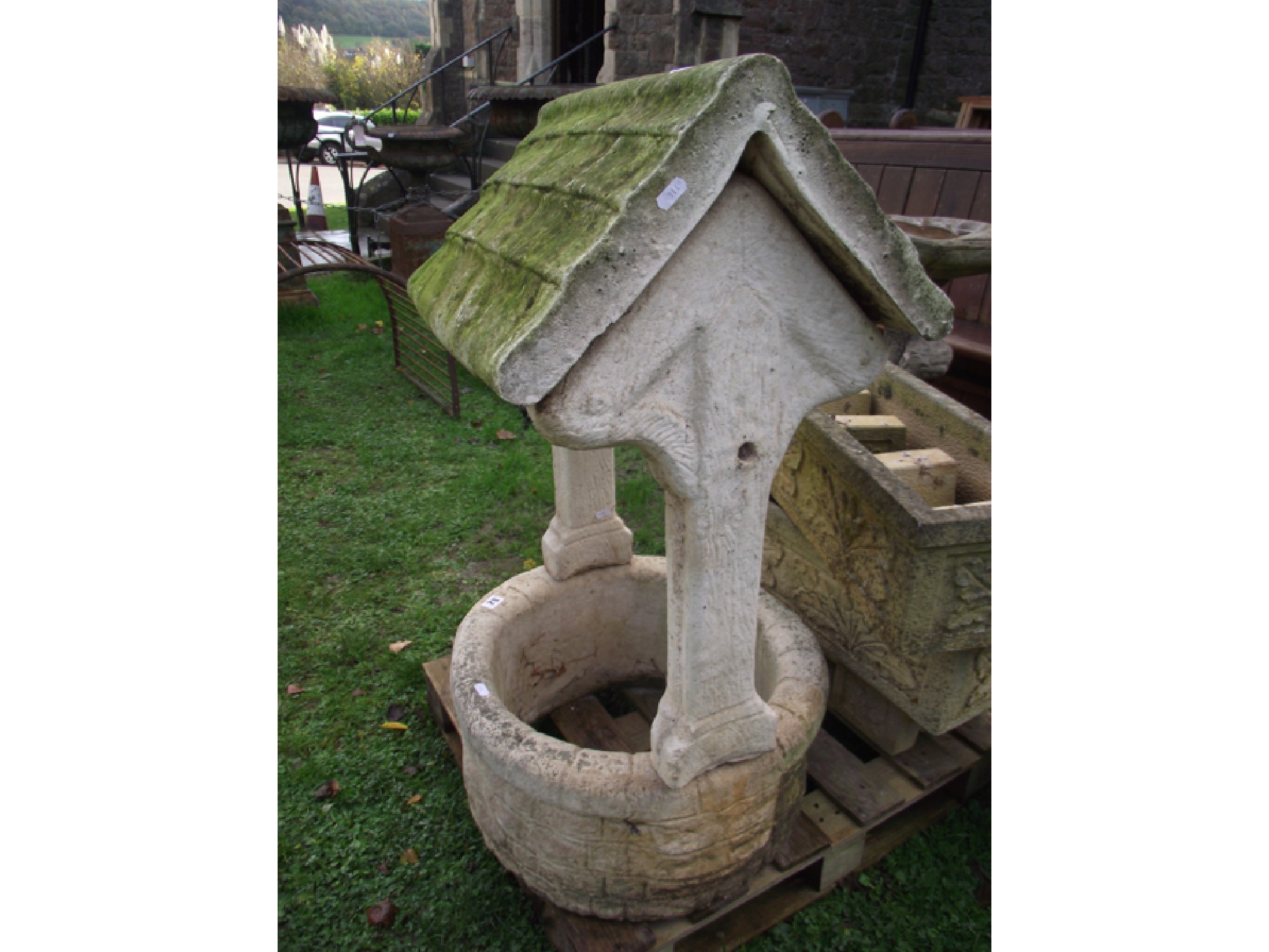 Appraisal: A weathered contemporary cast composition stone garden ornament in the