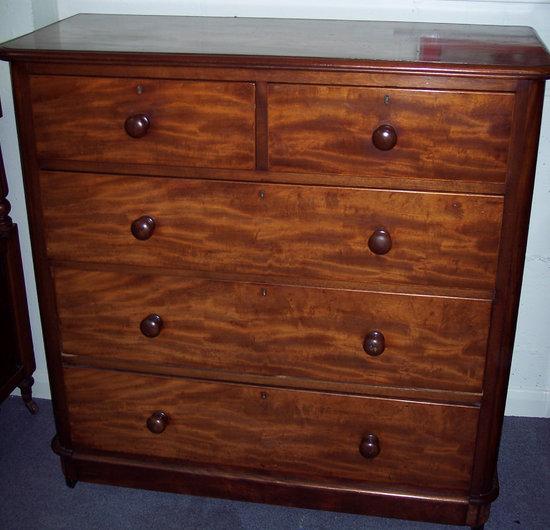 Appraisal: A Victorian mahogany chest of drawers of three long and