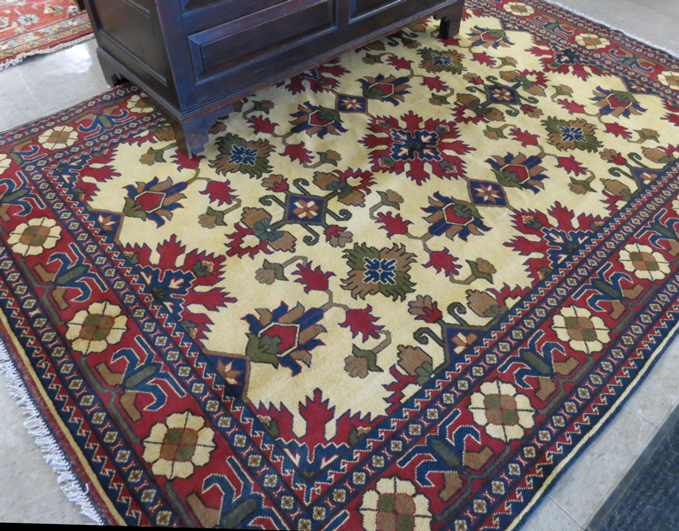 Appraisal: HAND KNOTTED ORIENTAL CARPET Persian tribal design of stylized -color