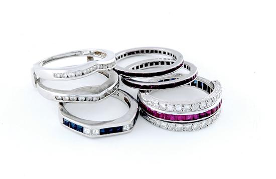 Appraisal: Platinum rings two bands channel-set with rubies one surround-set with