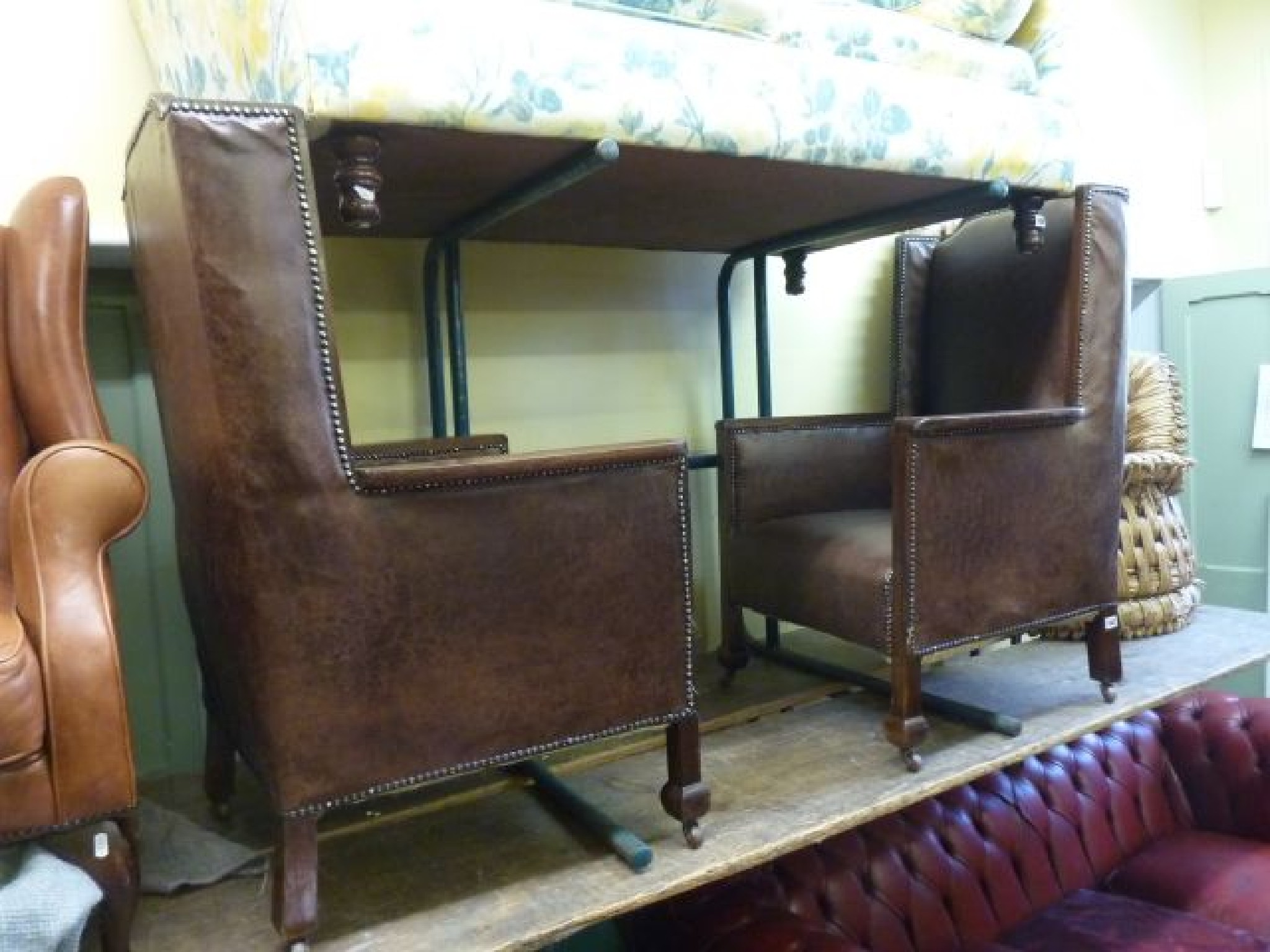 Appraisal: A pair of Edwardian fireside chairs with show wood frames