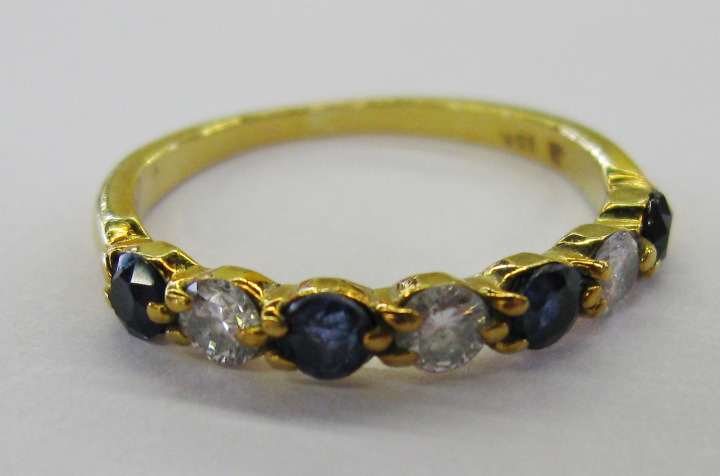 Appraisal: European Eighteen-Karat Yellow Gold Sapphire and Diamond Band Ring the