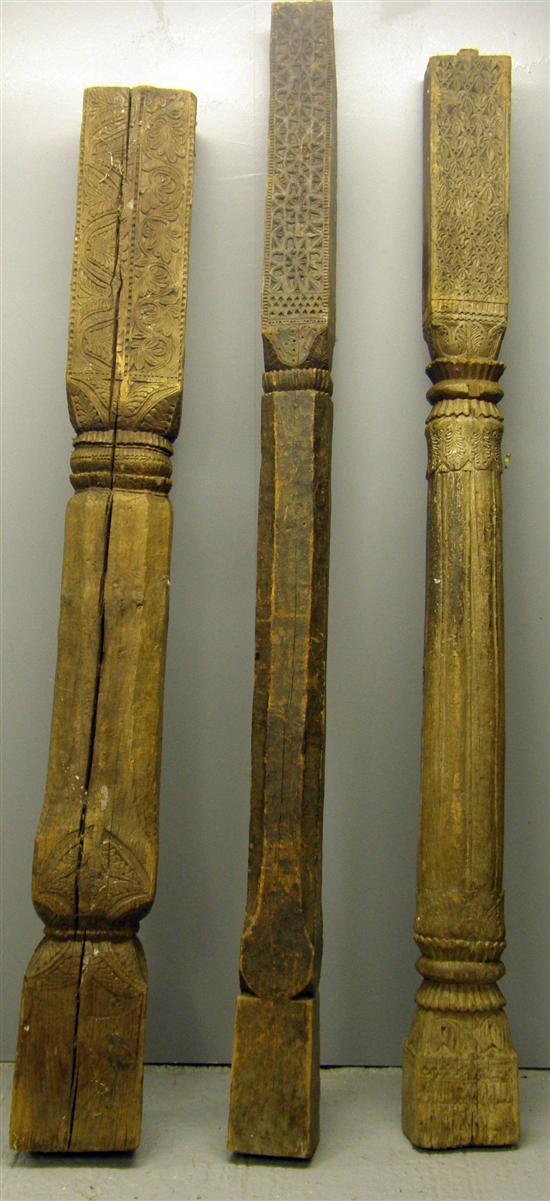 Appraisal: A Three carved Indian teak columns th century with stylised