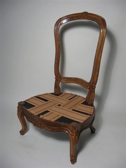 Appraisal: Louis XV walnut child's chair The curved toprail centered by