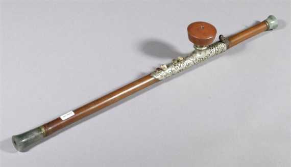 Appraisal: A SLENDER BAMBOO OPIUM PIPE WITH JADE ENDINGS China late