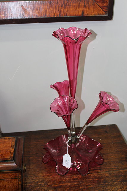 Appraisal: A VICTORIAN CRANBERRY GLASS TABLE CENTRE OR EPERGNE brass fittings