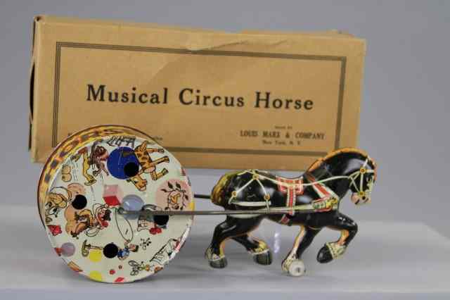 Appraisal: BOXED MUSICAL CIRCUS TOY Marx lithographed tin features horse drawn