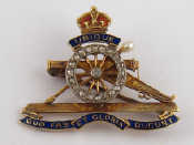 Appraisal: A carat gold diamond enamel and pearl Royal Artillery regimental