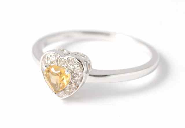 Appraisal: DIAMOND YELLOW CITRINE AND FOURTEEN KARAT GOLD RING featuring a