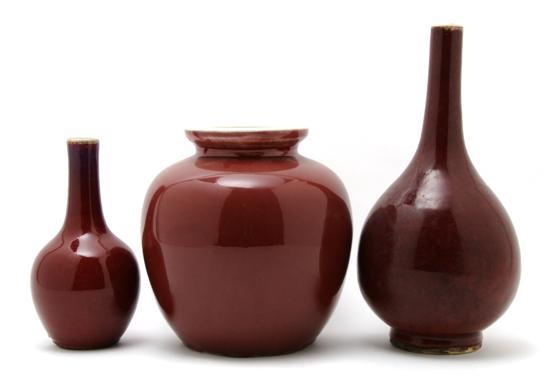 Appraisal: A Group of Three Oxblood Glazed Vases one bottle form