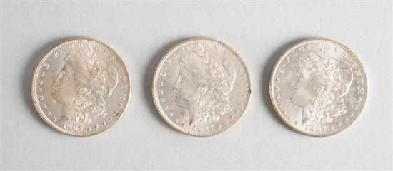 Appraisal: Three United States Morgan silver dollars O each MS- or