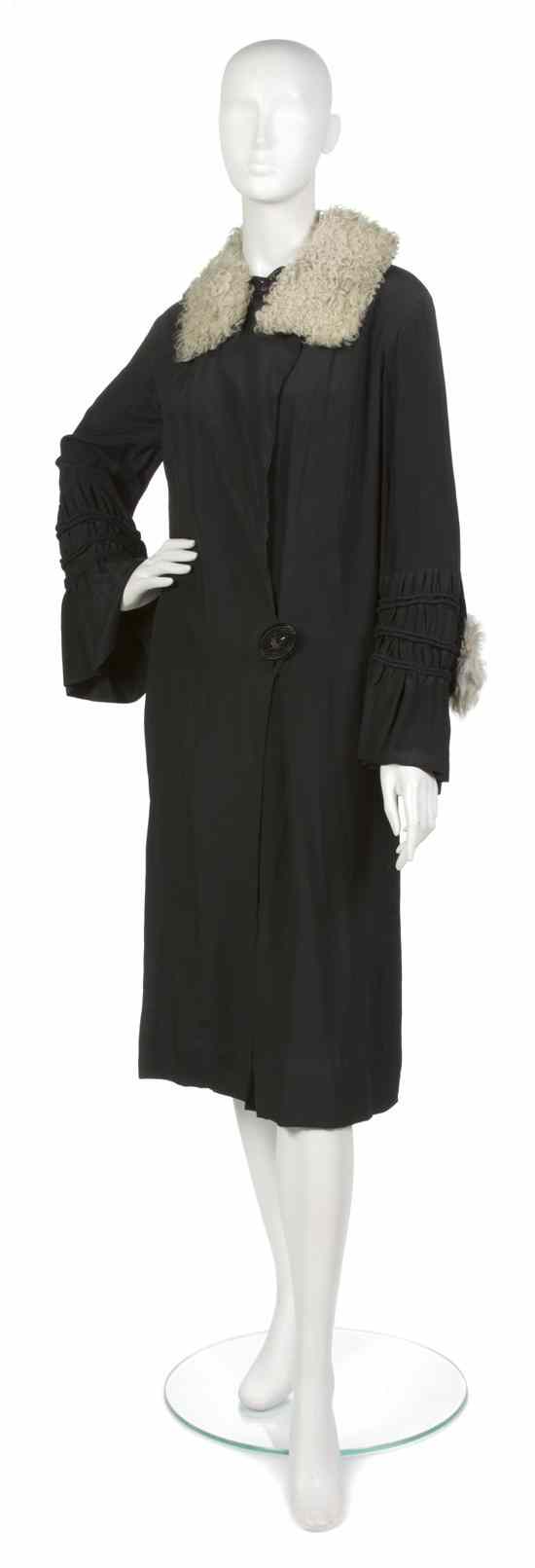 Appraisal: A Black Silk Coat probably s attached capelet trimmed in