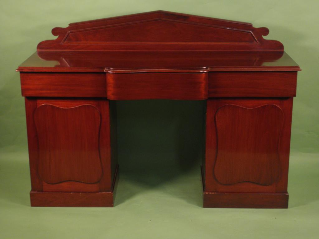 Appraisal: A Victorian mahogany pedestal sideboard with three frieze drawers above