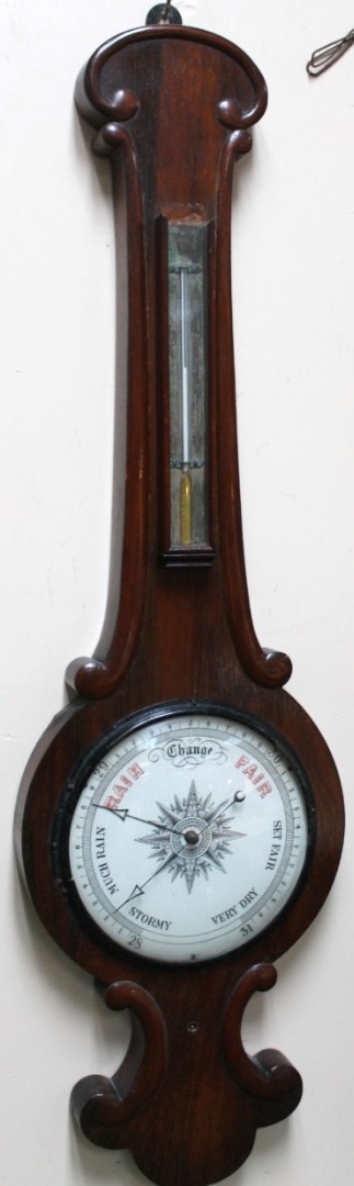 Appraisal: A thC rosewood two dial banjo barometer in a shaped