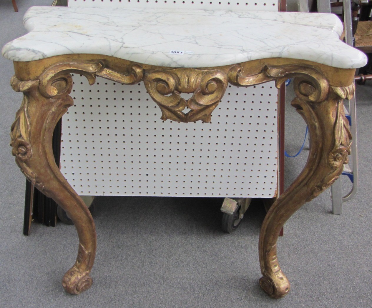 Appraisal: An th century design marble top serpentine console table on