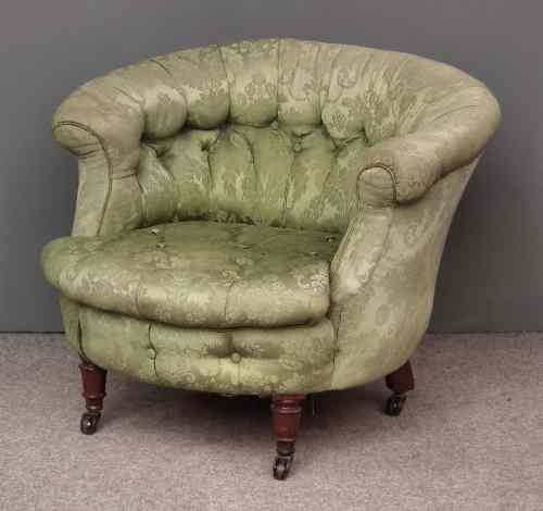 Appraisal: A Victorian tub shaped easy chair upholstered in green leaf