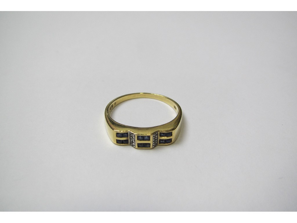 Appraisal: Eighteen carat gold step cut sapphire and diamond set ring