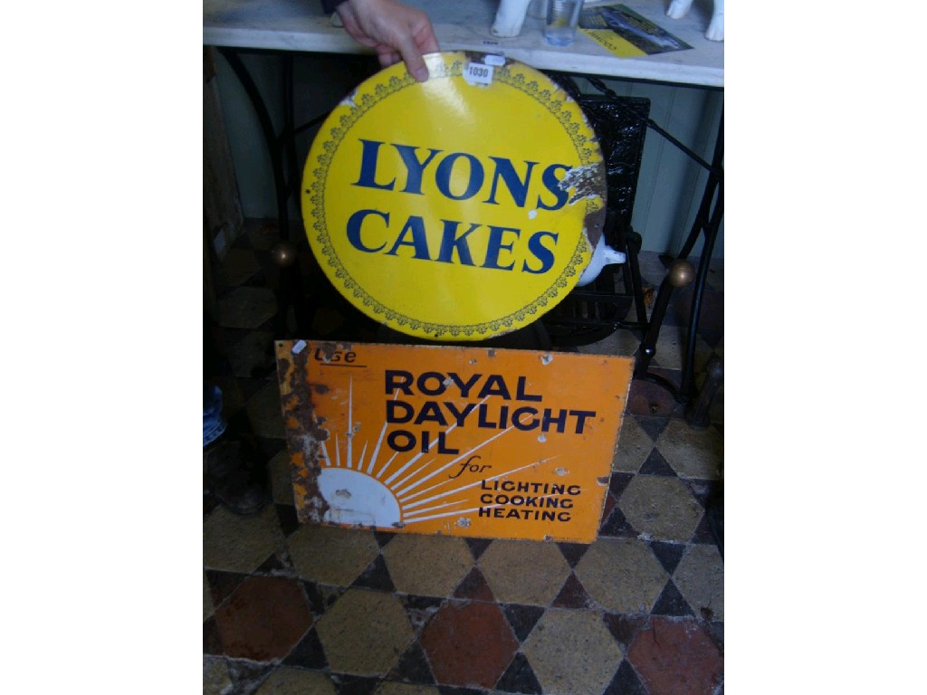 Appraisal: A small enamel sign of circular form advertising Lyons Cakes