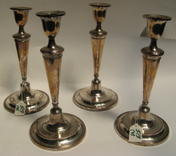 Appraisal: FOUR SILVER ON COPPER MATCHING CANDLE HOLDERS of the Victorian