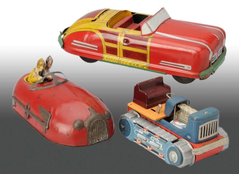 Appraisal: Lot of Tin Vehicle Toys Description Includes one Wyandotte woody