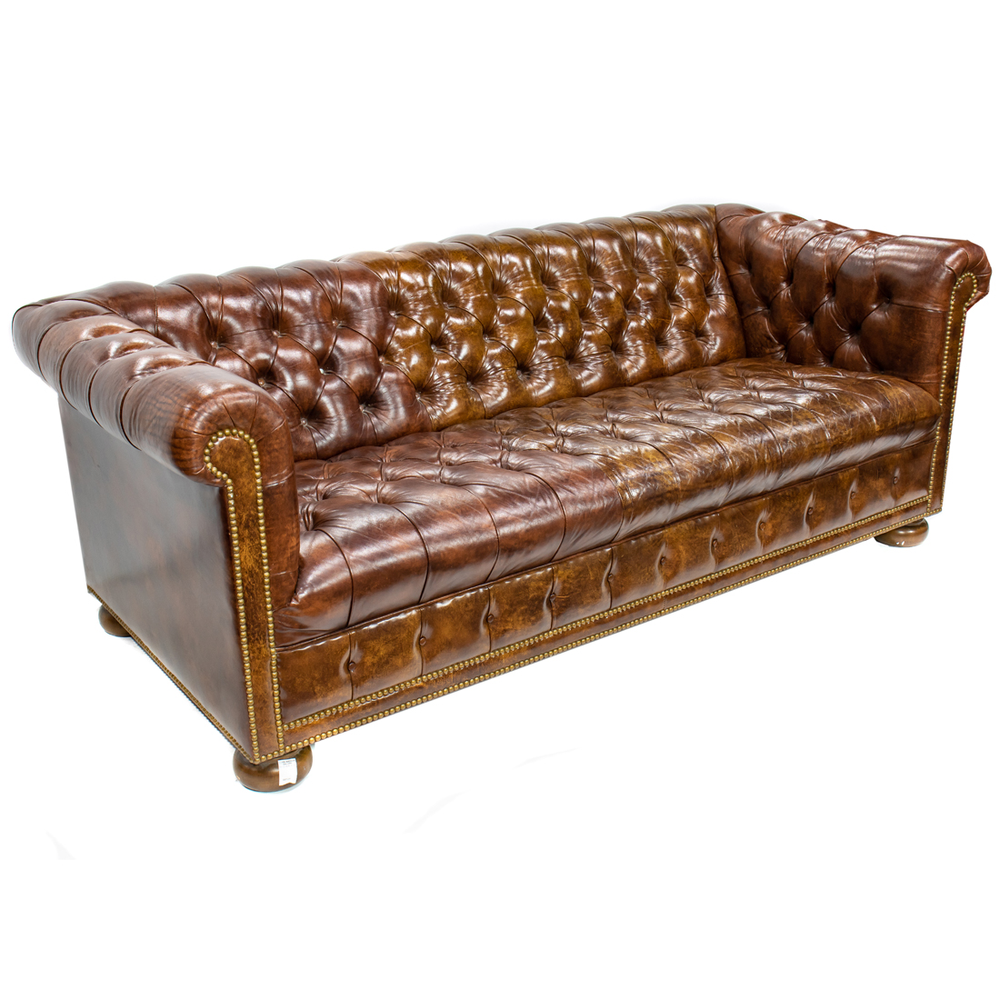 Appraisal: A CHESTERFIELD TUFTED SOFA A Chesterfield tufted sofa having nail