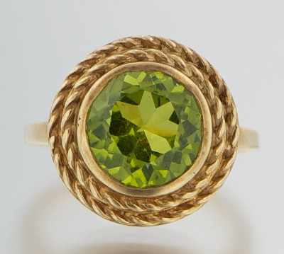 Appraisal: A Ladies' Peridot Ring k yellow gold ring with a