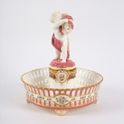 Appraisal: A Minton pierced footed figural comport circa printed pink marks