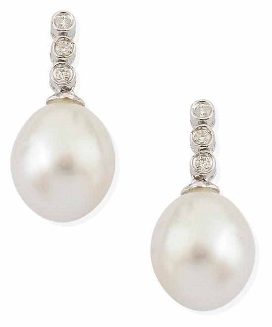 Appraisal: A PAIR OF SOUTH SEA PEARL AND DIAMOND EARRINGS Each