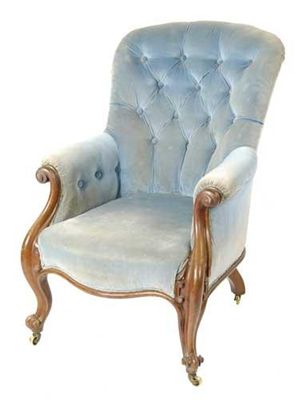 Appraisal: A Victorian carved mahogany and button back upholstered armchair on