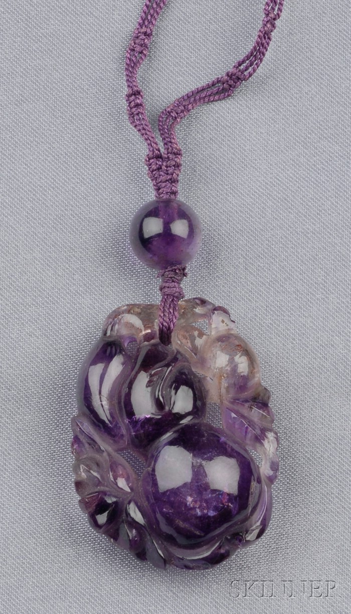 Appraisal: Carved Amethyst Pendant depicting gourds suspended from a bead and